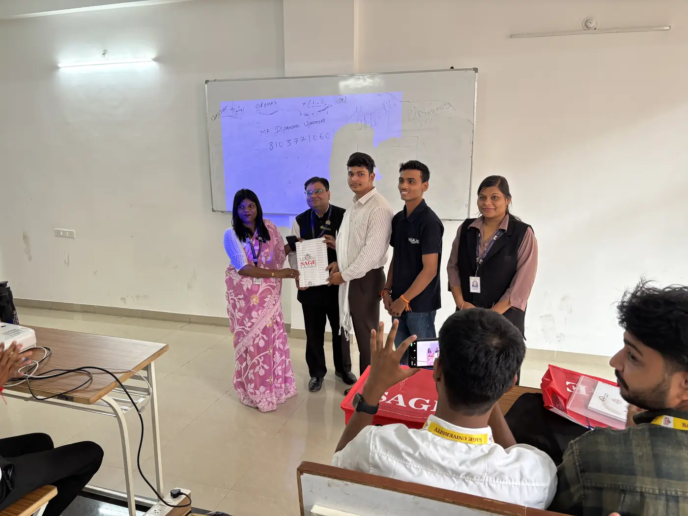 A certificate being handed over at the end of a workshop