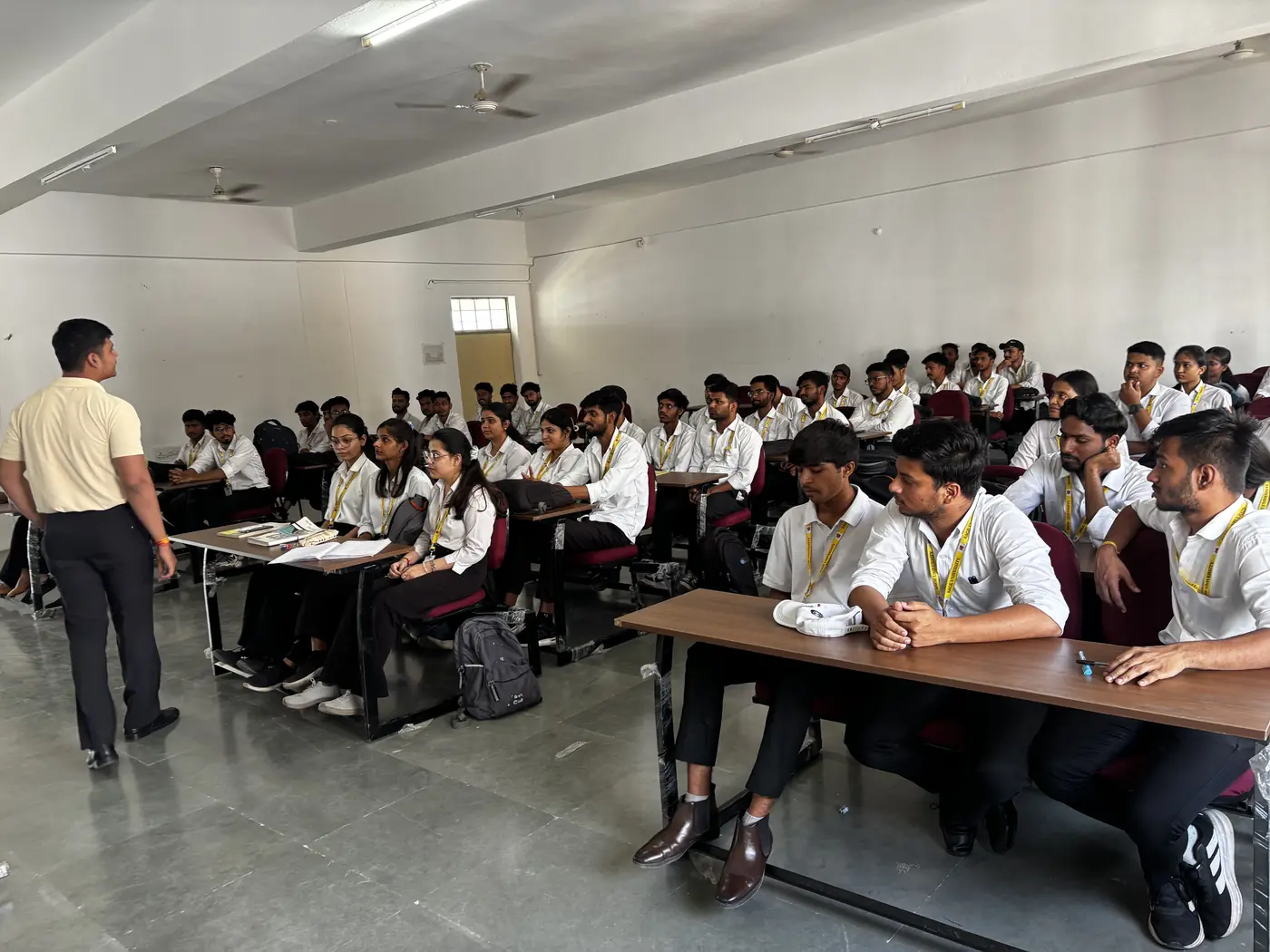 College students seated in a lecture room during a workshop