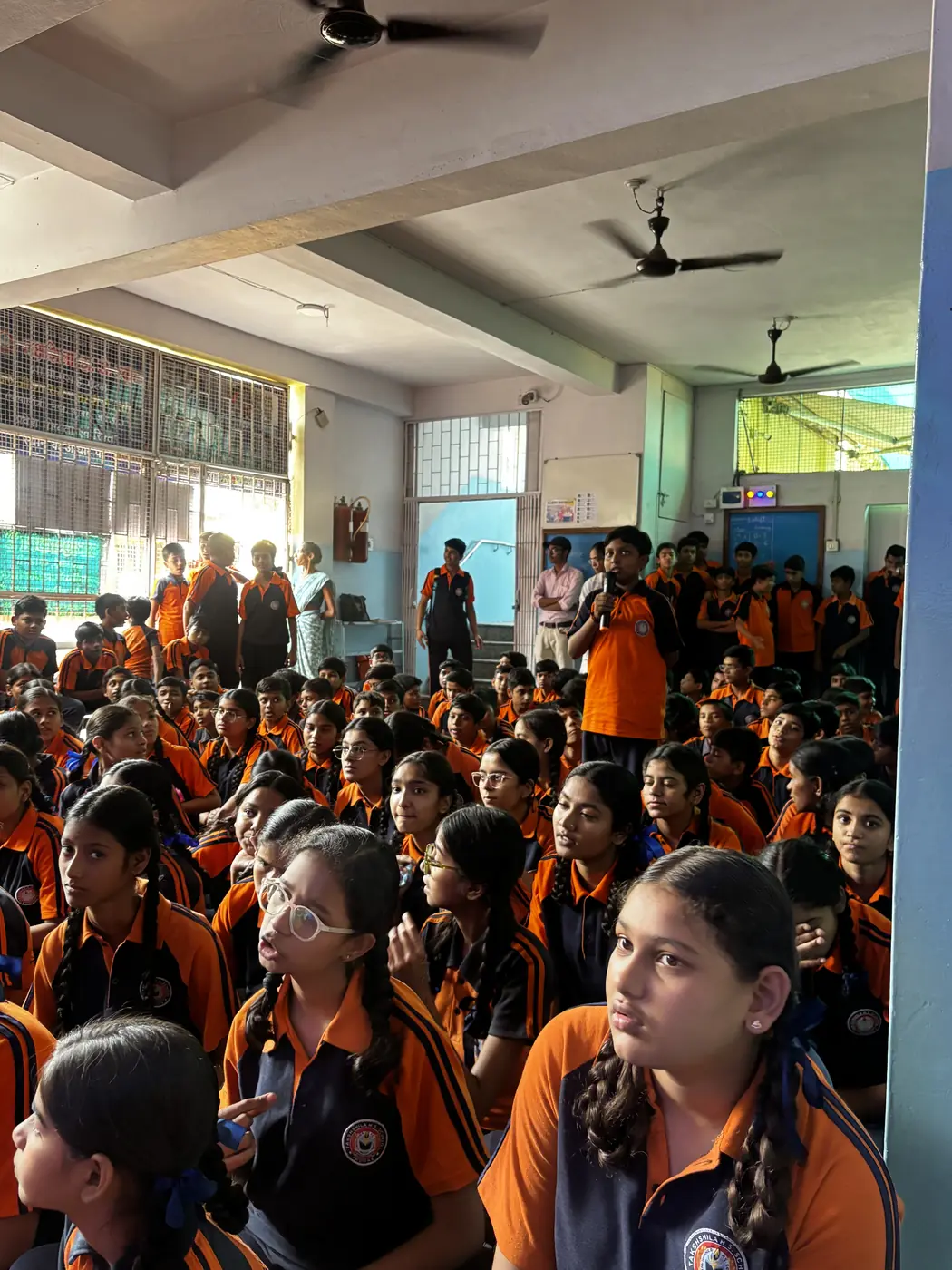 School assembly hall filled with students during a STEM session