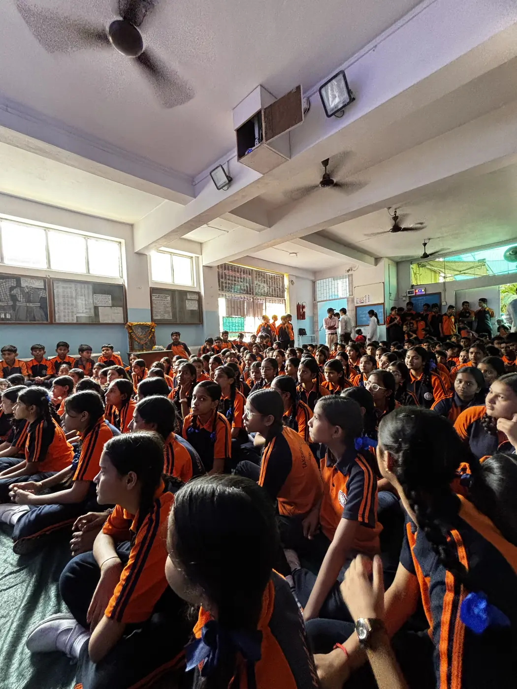 Rows of school students in uniform attending a STEM session