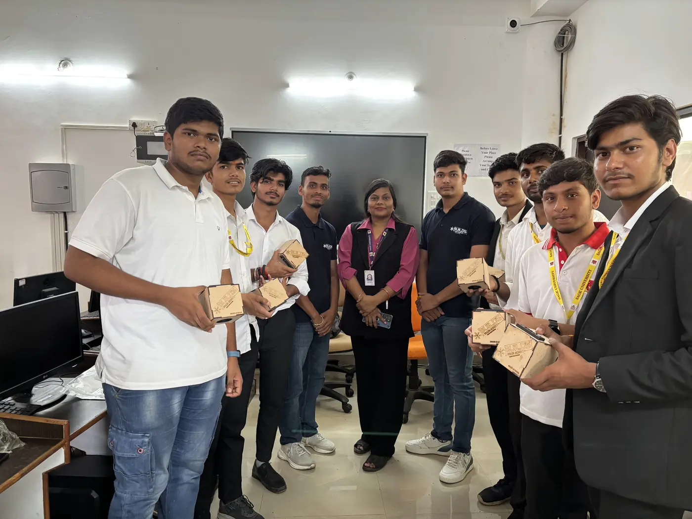 Students and faculty showing completed project kits