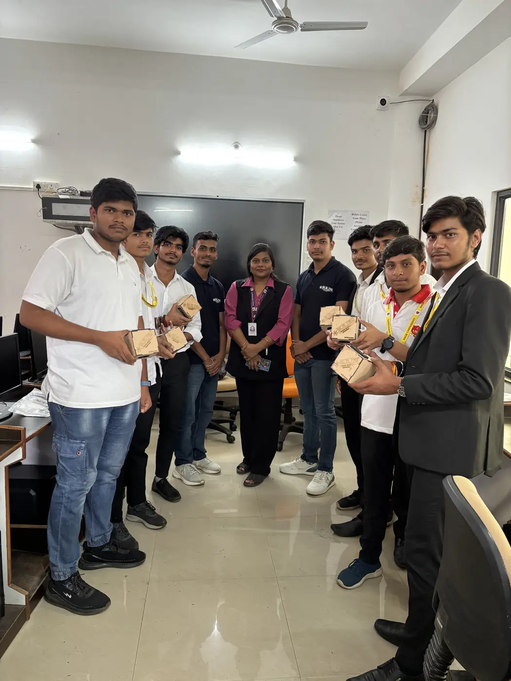 A group of students holding their completed kits