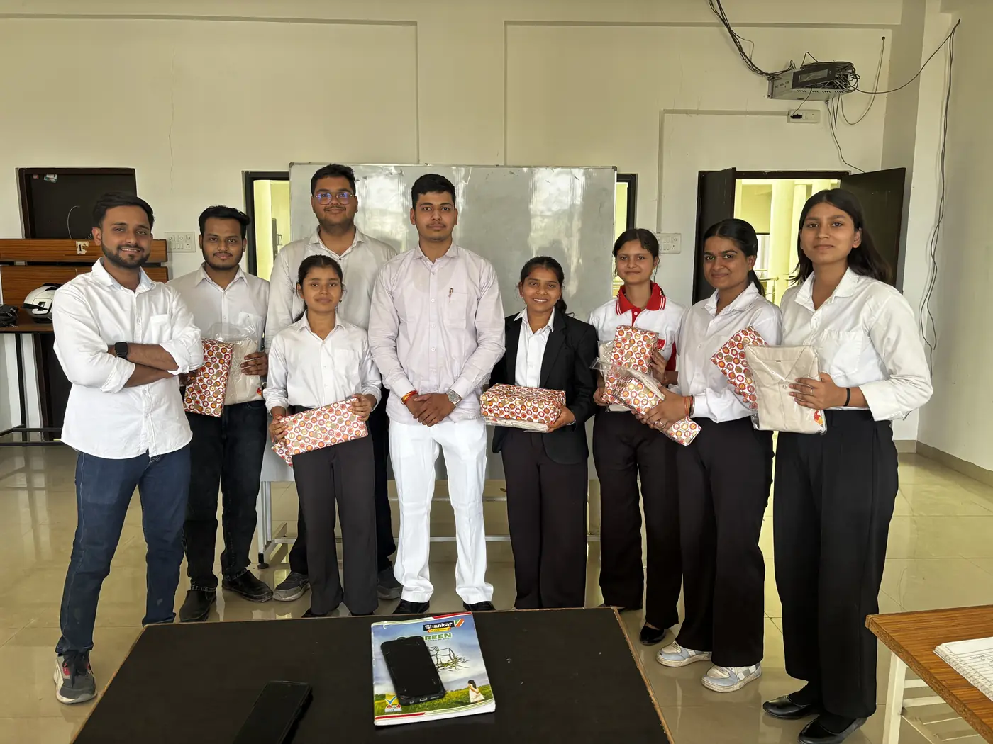 A team holding gift hampers after a session