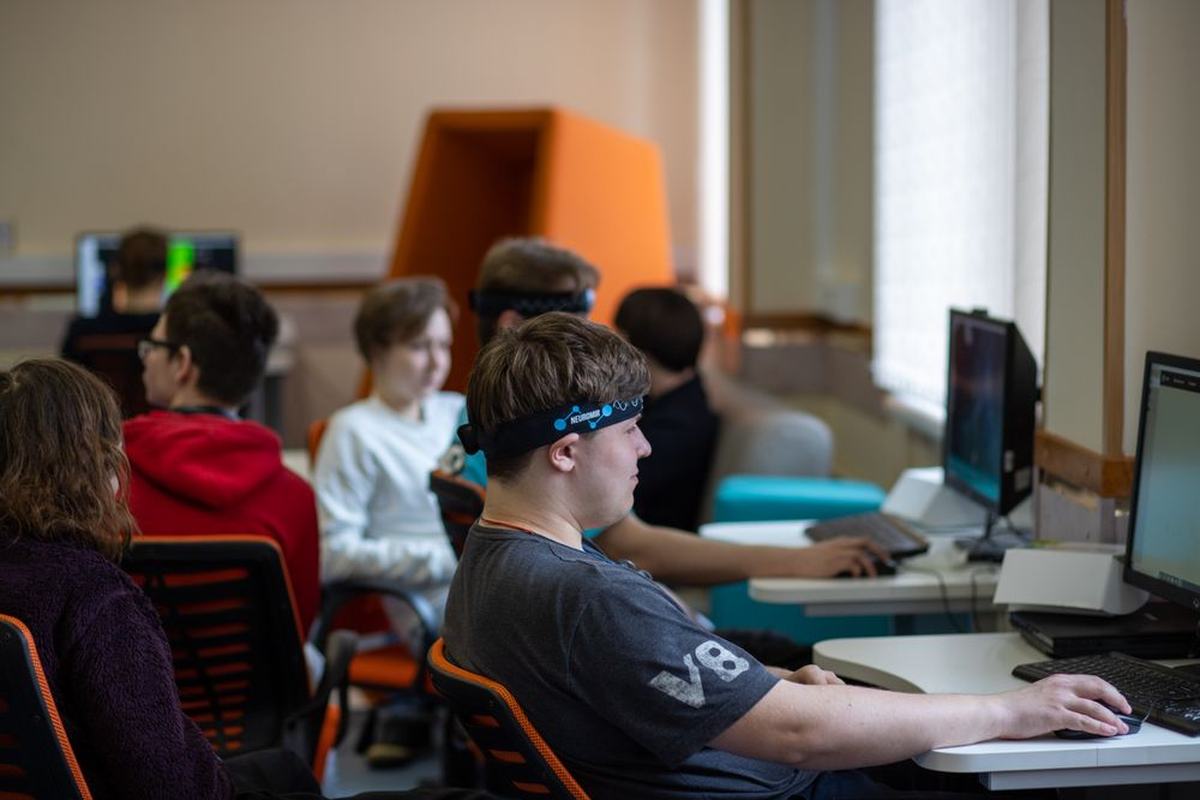 Students working at computers in a classroom